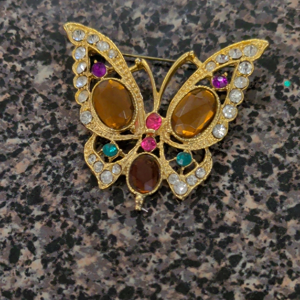 Elegant Gold Butterfly Brooch with Gem Accents